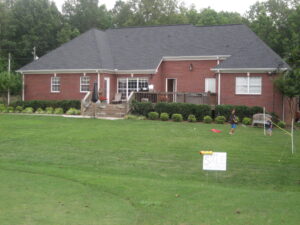 A large house with a lawn in front of it