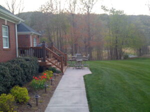 A walkway leading to the back of a house.