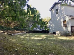 A house with trees and grass in the yard