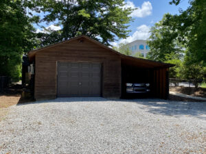 A garage with a car parked in it.