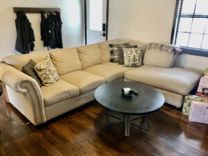 A living room with a couch and coffee table