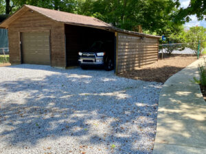 A car parked in the garage of a house.