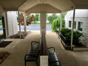 A bench in the middle of an outdoor area.