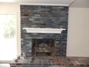 A fireplace with brick and stone in the middle of it.