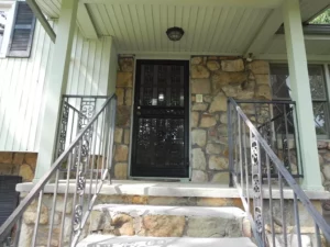 A black door on the front of a house.