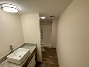 A bathroom with a sink and toilet in it