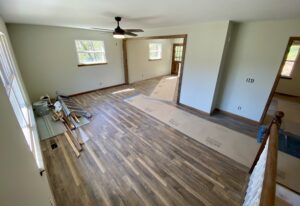 A room with wood floors and a ceiling fan.