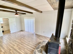 A room with wood floors and a fireplace.