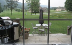 A view of a golf course from outside the house.