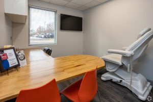 A room with a table and chairs in it