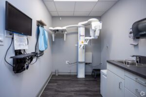 A room with a tv and some hanging equipment