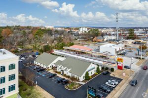 A view of the parking lot and buildings from above.