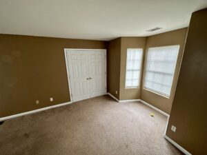 A room with brown walls and white trim.