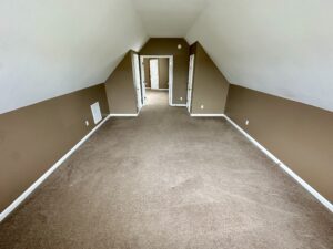 A room with brown walls and white trim.