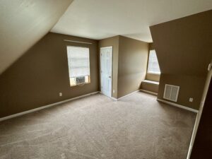 A room with tan walls and white trim.