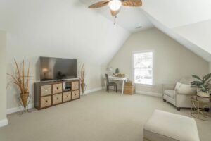 A living room with a tv and couch in it