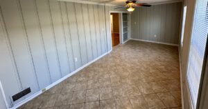 A room with tile floors and walls.