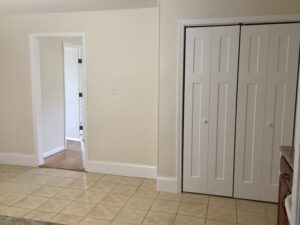 A room with two doors and tiled floors