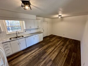 a kitchen with marble countertop