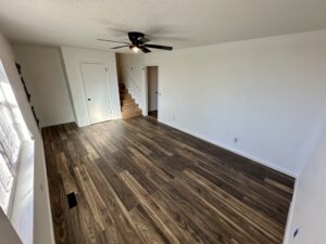 an empty room with a ceiling fan