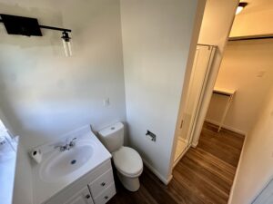 view of the sink and commode in a bathroom