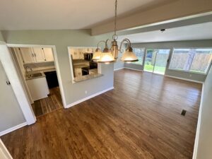 Kitchen and dining room with hardwood floors.