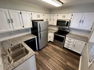 Kitchen with white cabinets and stainless steel appliances.