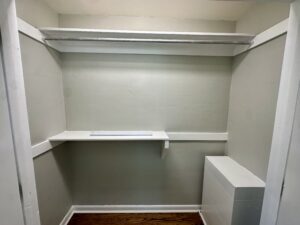 Empty closet with shelf and rod.