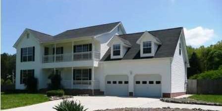 Two-story white house with double garage